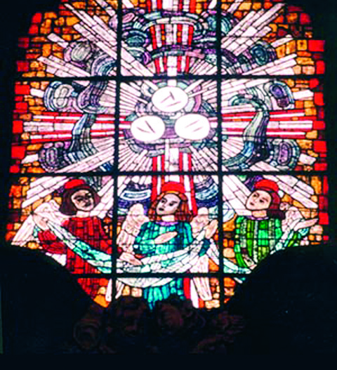 The stained glass window in which the three miraculous Hosts are depicted